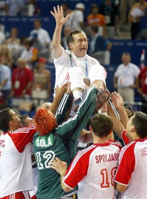 Cro handball triumph in Athens, 2004, Lino Cervar on hands of his team (AP Photo/Alastair Grant)